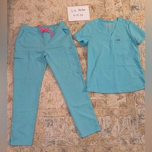 Figs scrubs neon blue color with pink tie